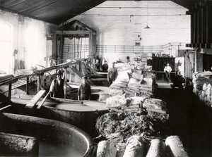 The hollander salle of Hovilanhaara paper mill. At the front, rolled pulp and folded sheets of mechanical pulp.
