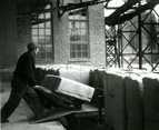   Einari Haromo carting bales of pulp to the wagon behind the works engine in 1946.